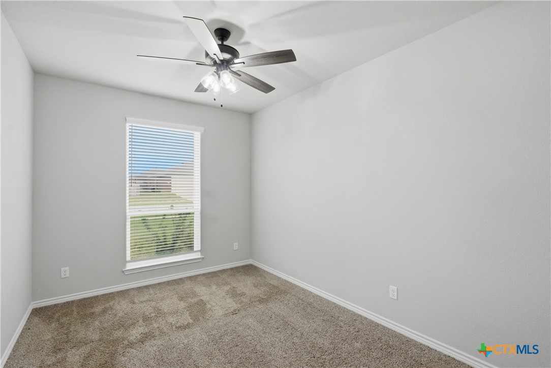 3201 Hedwig Street Killeen, TX 76549 - Photo 30 of 38 an empty room with windows and fan