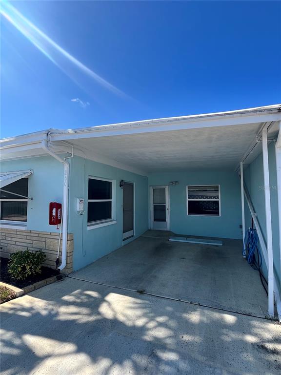 250 Rosery Road Northwest, Unit 260 Largo, FL 33770 - Photo 2 of 8 a view of a house with a backyard