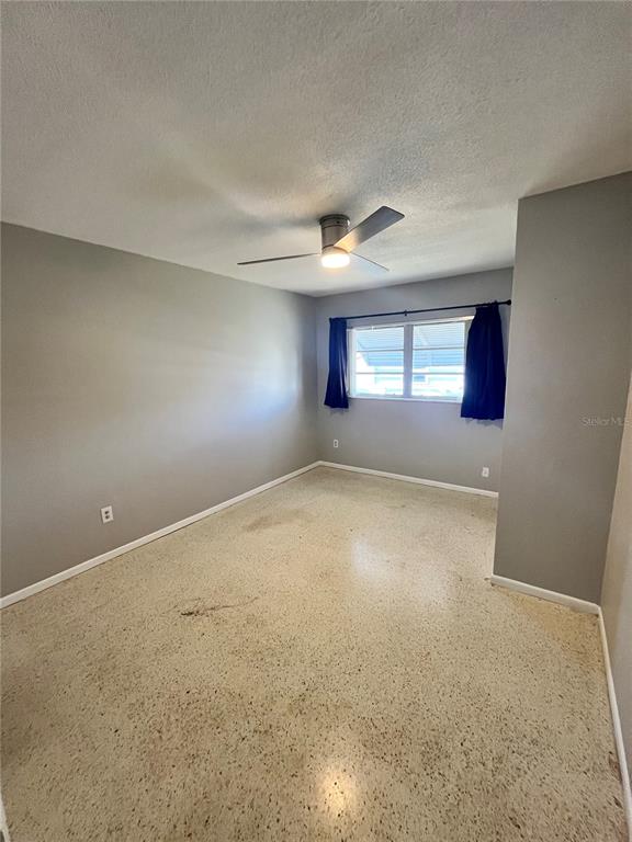 250 Rosery Road Northwest, Unit 260 Largo, FL 33770 - Photo 5 of 8 an empty room with windows and closet