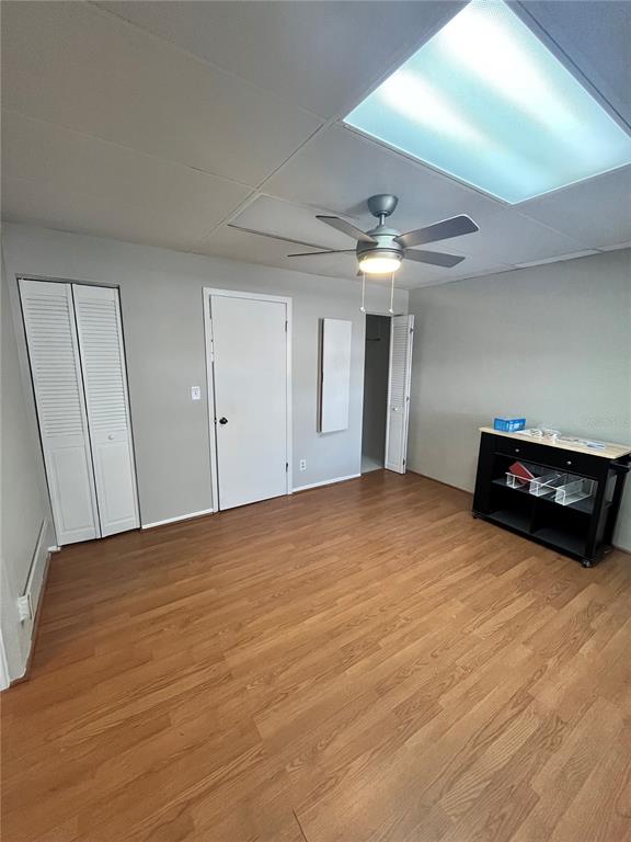 250 Rosery Road Northwest, Unit 260 Largo, FL 33770 - Photo 7 of 8 a view of empty room with wooden floor