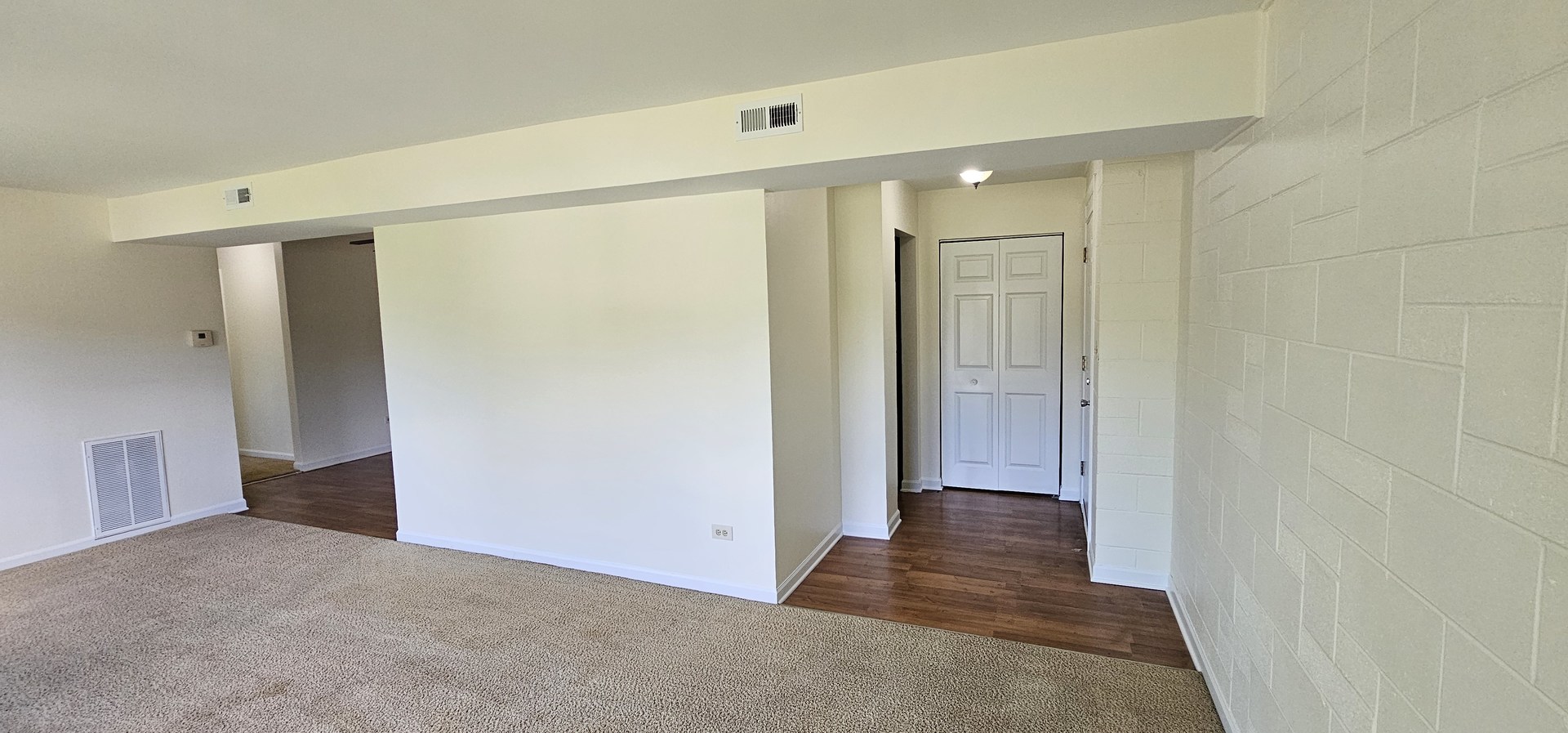 833 Village Quarter Road, Unit A3 West Dundee, IL 60118 - Photo 19 of 27 a view of a hallway with wooden floor and closet area