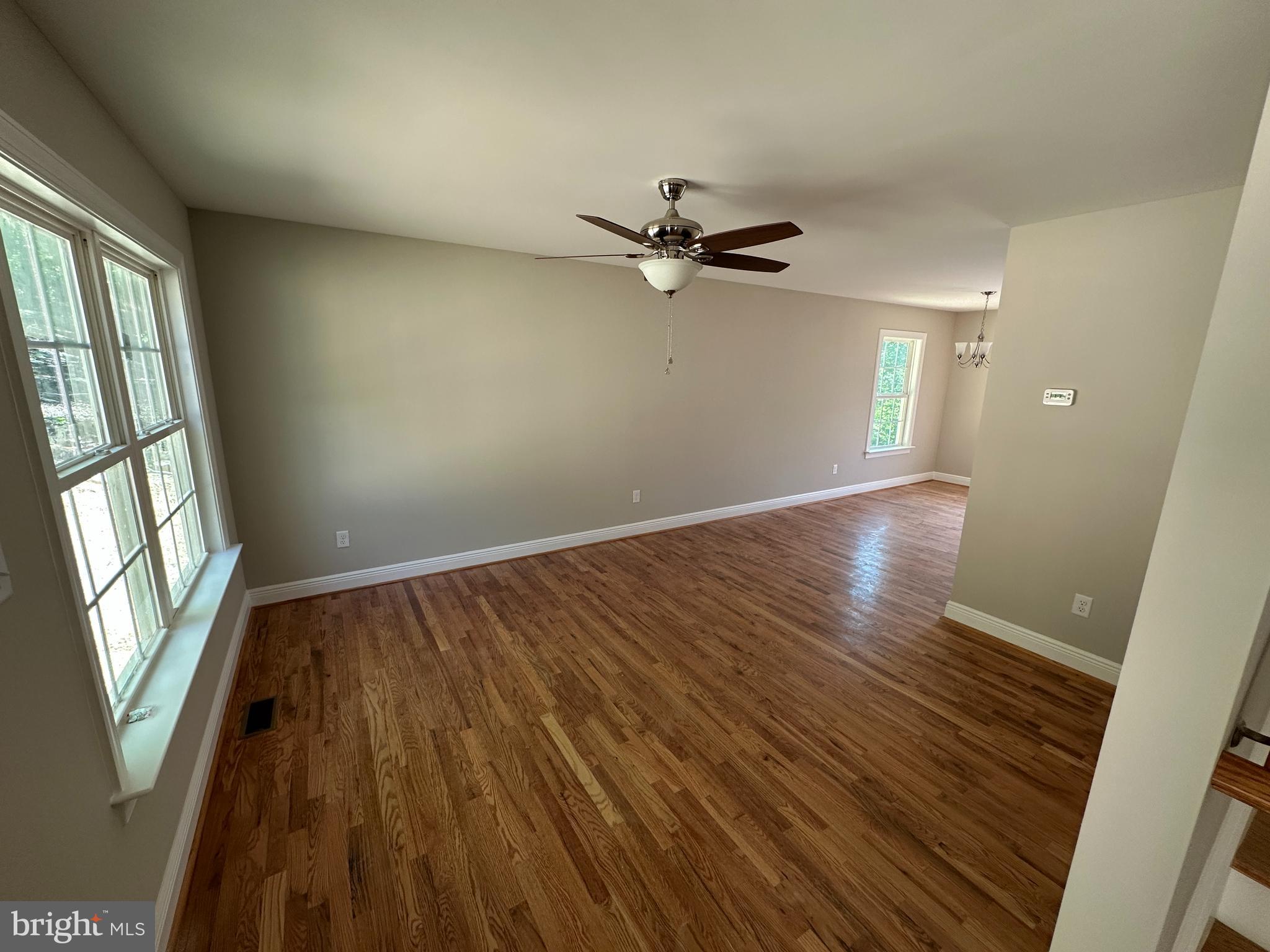 211 Inca Trail Winchester, VA 22602 - Photo 4 of 23 wooden floor in an empty room with a window