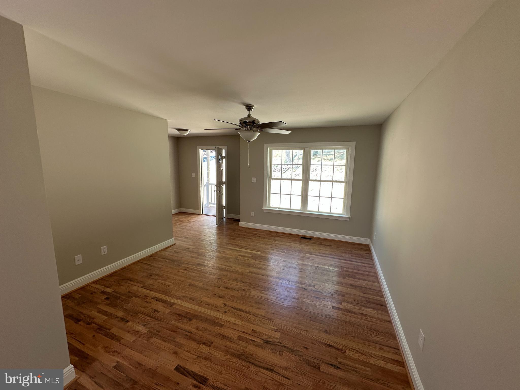 211 Inca Trail Winchester, VA 22602 - Photo 5 of 23 wooden floor in an empty room with a window