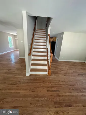 a kitchen with stainless steel appliances granite countertop a sink a stove a refrigerator and microwave