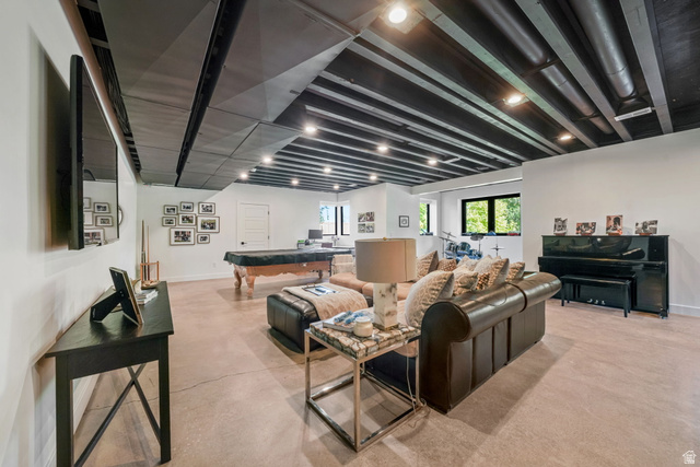 3667 Little Cottonwood Road, Unit 1 Sandy, UT 84092 - Photo 34 of 49 Expansive room featuring painted exposed ceiling beams, recessed lighting, and concrete flooring
