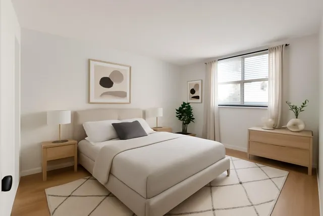 a bedroom with a bed and a couch