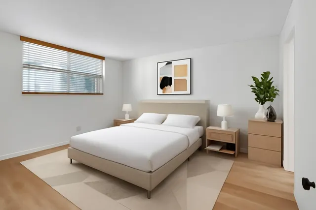 a bedroom with a bed and window