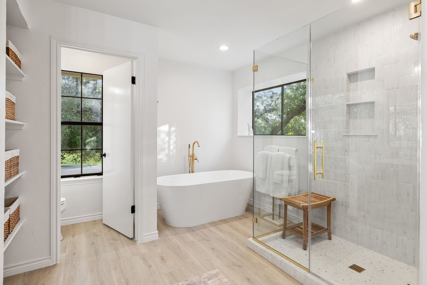 5 Valhalla Court The Hills, TX 78738 - Photo 17 of 34 Freestanding soaking tub and walk-in shower with elegant finishes.