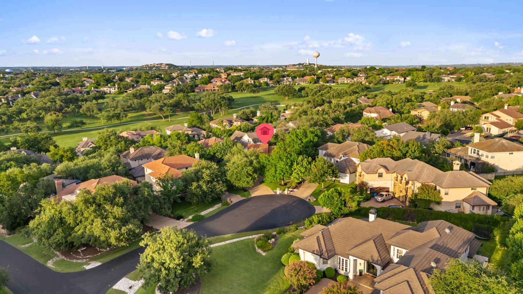 5 Valhalla Court The Hills, TX 78738 - Photo 2 of 34 Prime cul-de-sac setting surrounded by mature oaks and golf community views.