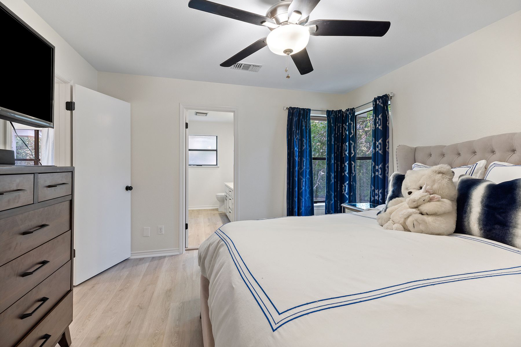 5 Valhalla Court The Hills, TX 78738 - Photo 22 of 34 Bright guest room with large windows and direct bath access.