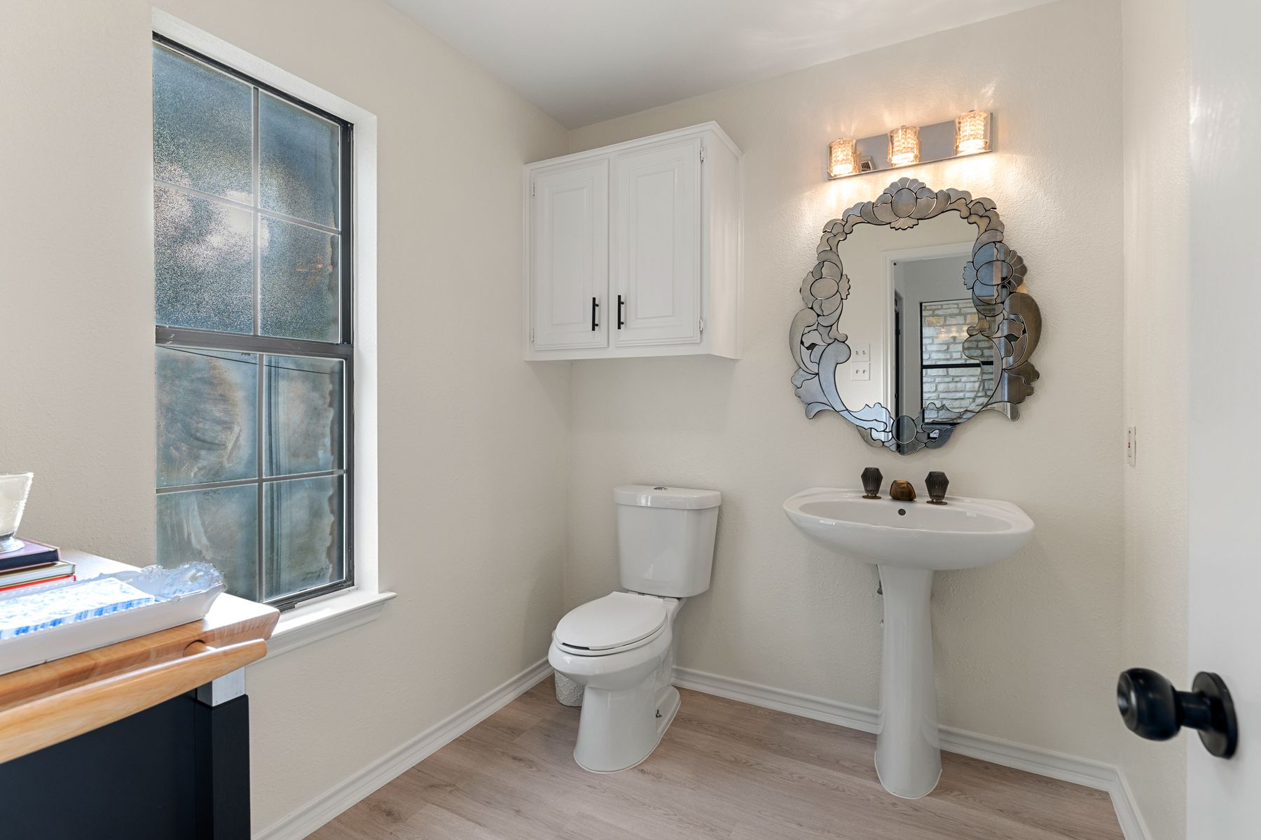 5 Valhalla Court The Hills, TX 78738 - Photo 23 of 34 Convenient main-level powder bath for guests.