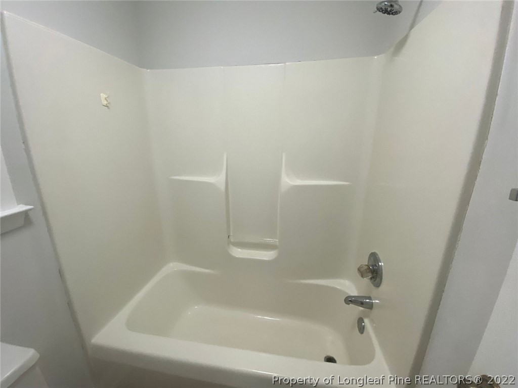 944 Flintwood Road Fayetteville, NC 28314 - Photo 11 of 50 a bathroom with a bathtub