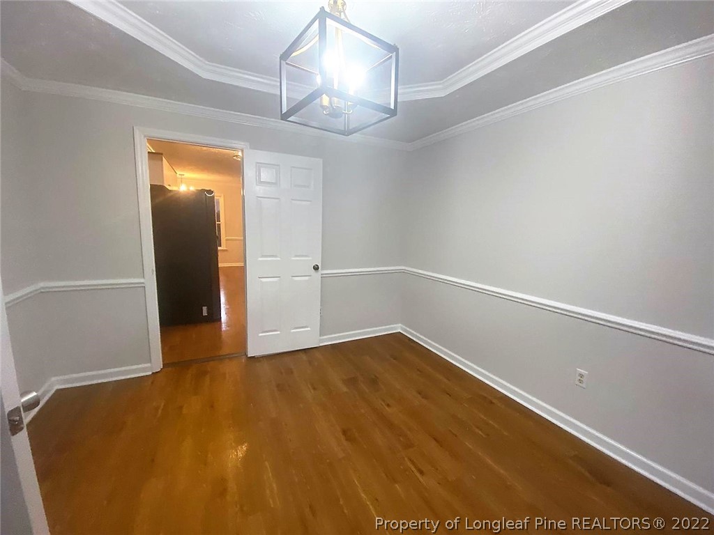 944 Flintwood Road Fayetteville, NC 28314 - Photo 16 of 50 a view of an empty room with wooden floor