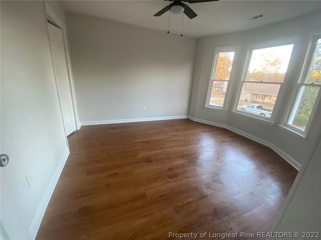 944 Flintwood Road Fayetteville, NC 28314 - Photo 18 of 50 wooden floor in an empty room with a window