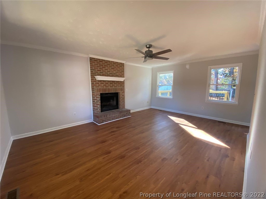 944 Flintwood Road Fayetteville, NC 28314 - Photo 34 of 50 a view of an empty room with window and wooden floor