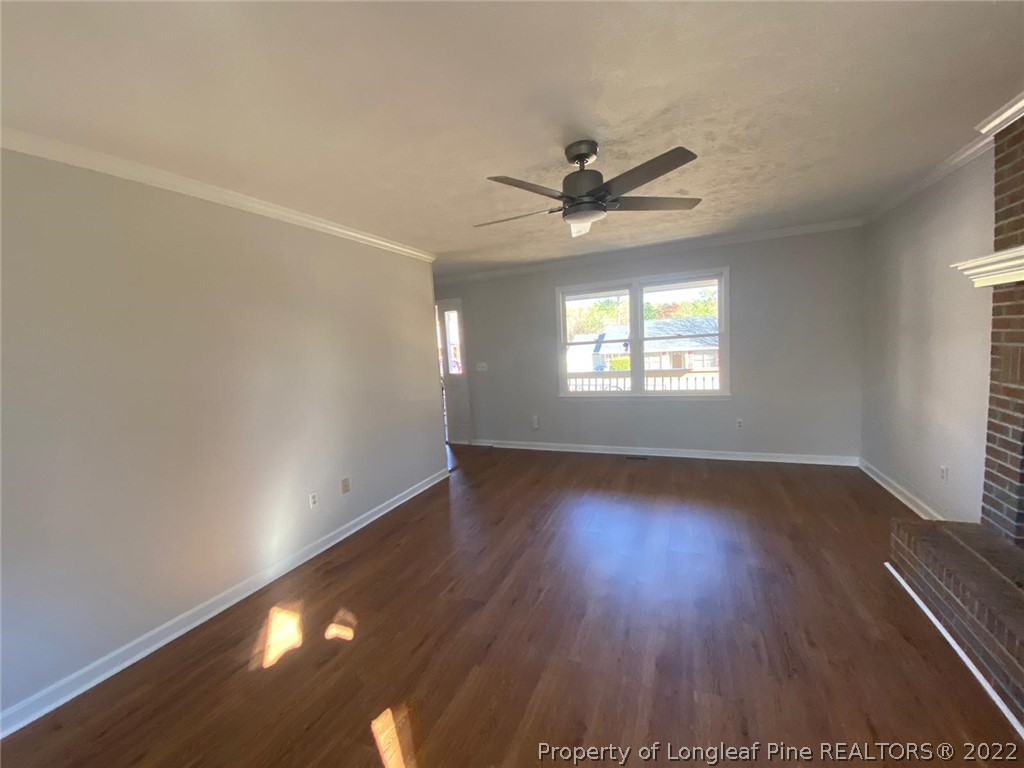 944 Flintwood Road Fayetteville, NC 28314 - Photo 35 of 50 an empty room with wooden floor and windows
