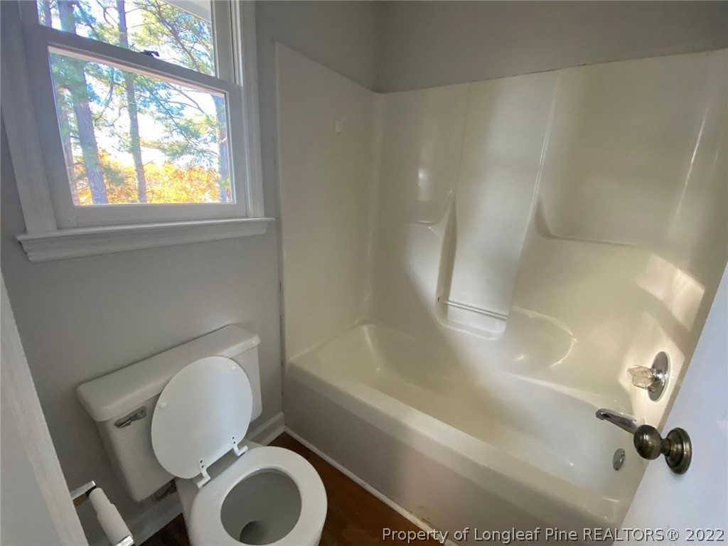 944 Flintwood Road Fayetteville, NC 28314 - Photo 46 of 50 a bathroom with a toilet and a bathtub