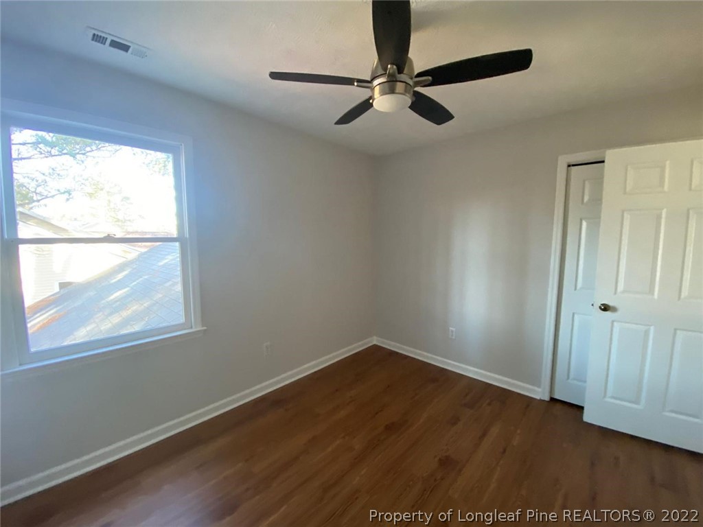 944 Flintwood Road Fayetteville, NC 28314 - Photo 48 of 50 a view of a big room with wooden floor closet and windows