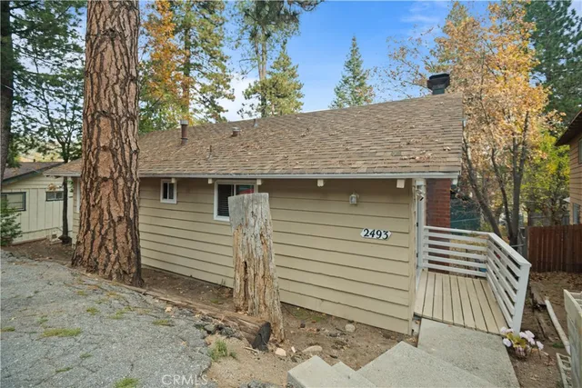 a view of a house with a tree