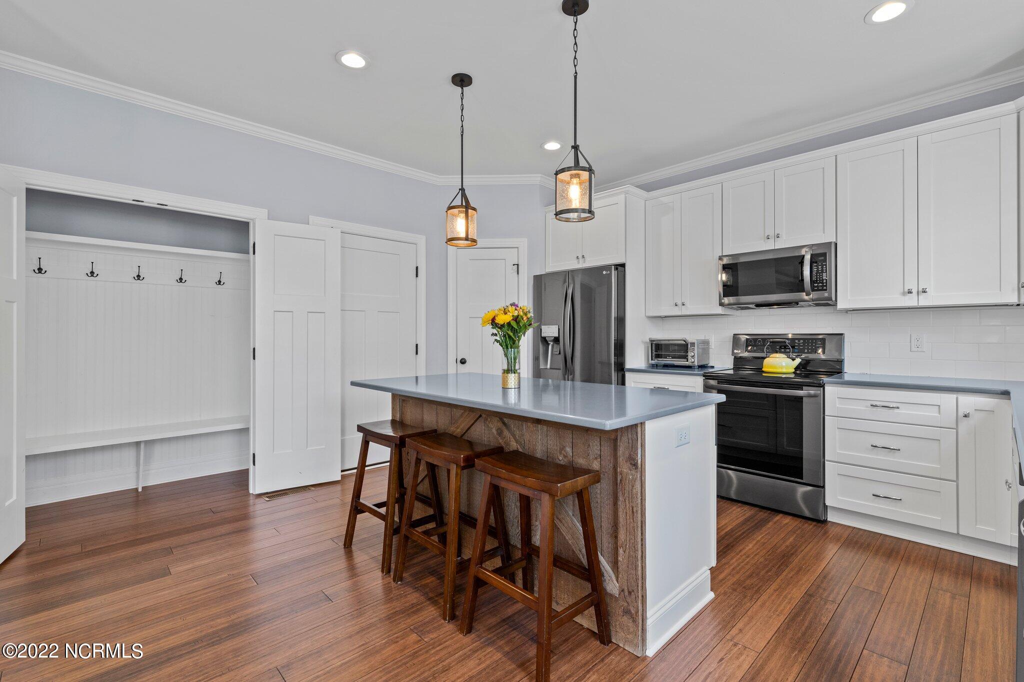 6 Alexander Lane Pinehurst, NC 28374 - Photo 23 of 52 Kitchen with Drop Zone closet doors open