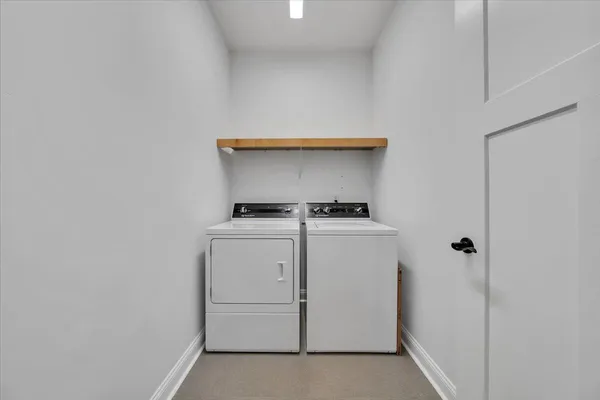 a view of a patio with a table chairs and garden