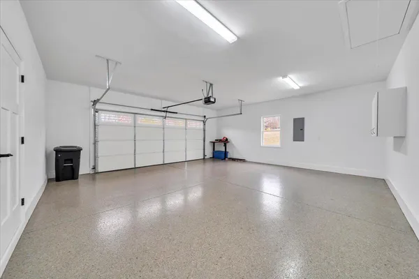 a view of a house with a swimming pool and a yard