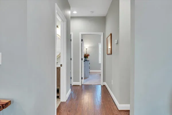 a spacious bedroom with a bed and a chandelier