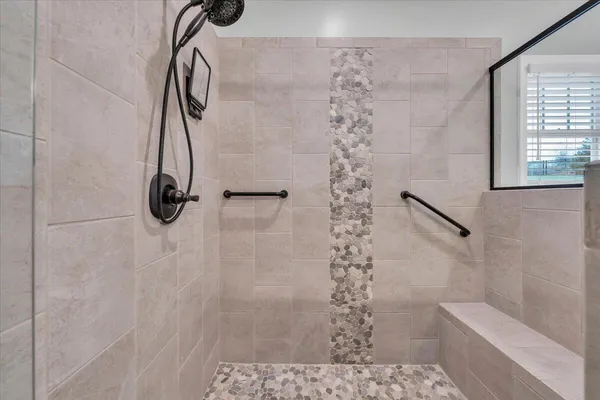 a bathroom with a double vanity sink and a mirror