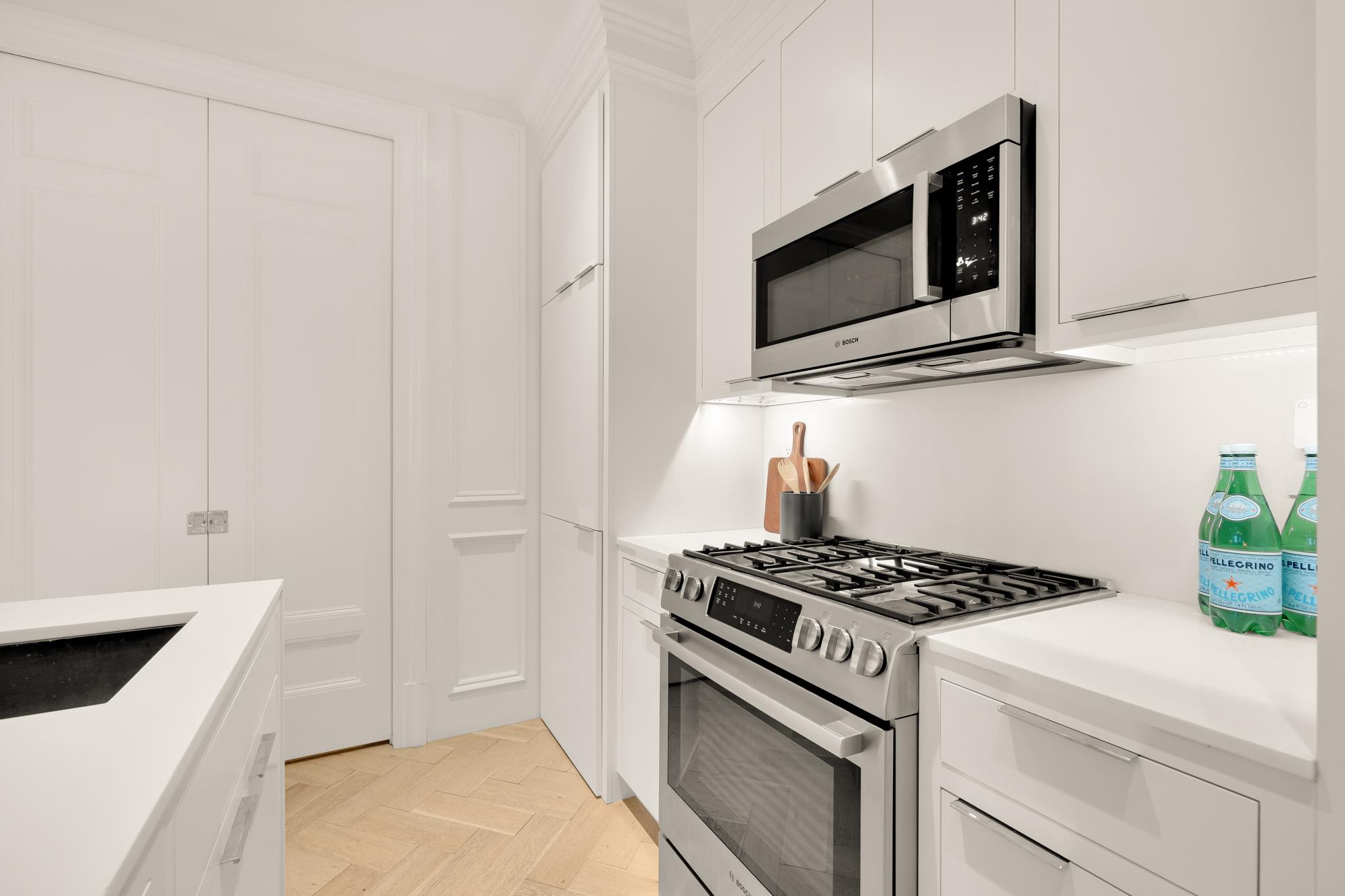 2007 Wyoming Avenue Northwest, Unit 16 Washington, DC 20009 - Photo 8 of 15 Sleek modern kitchen with clean lines.