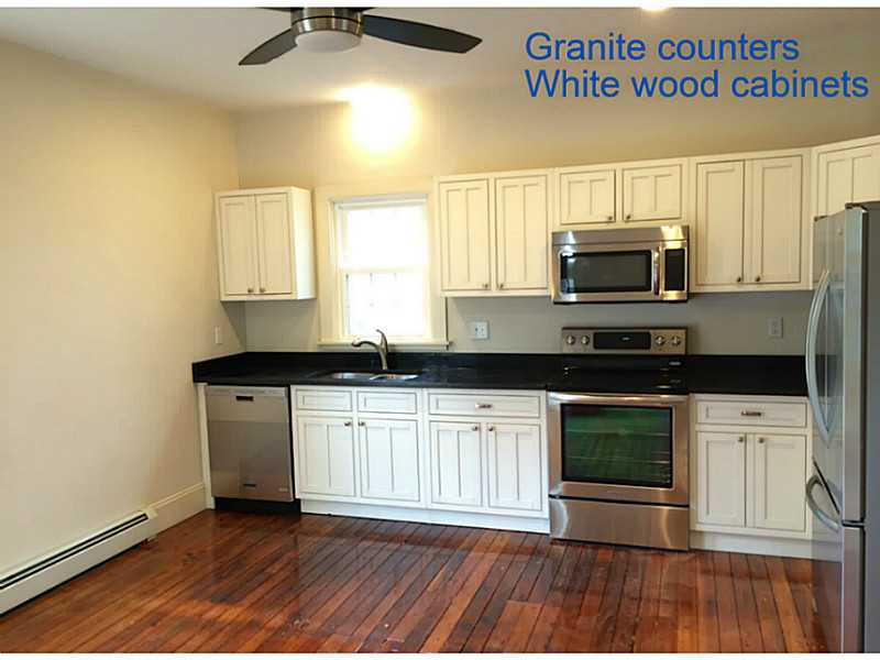 467 Ten Rod Road North Kingstown, RI 02852 - Photo 4 of 25 Kitchen. Includes dishwasher, stove, microwave & refrigerator and overhead fan