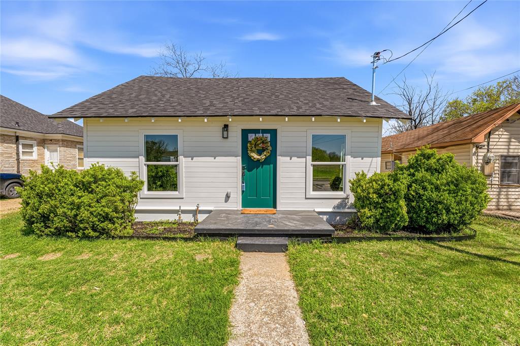 815 Garrison Street Waco, TX 76704 - Photo 1 of 36 a front view of a house with garden