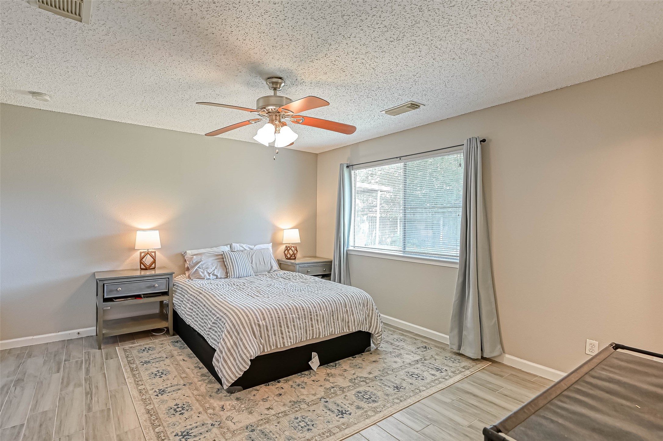 22622 John Rolfe Lane Katy, TX 77449 - Photo 15 of 21 a bedroom with a bed and a window