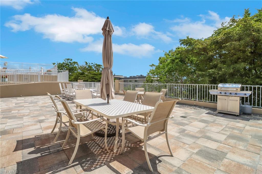 401 Bayfront Place, Unit 3502 Naples, FL 34102 - Photo 17 of 22 View of patio / terrace with a grill and outdoor dining space