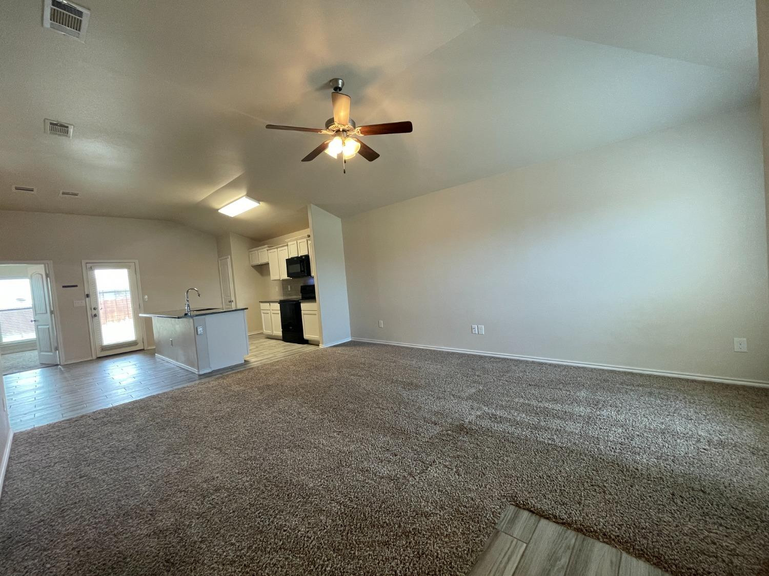 7513 103rd Street Lubbock, TX 79424 - Photo 2 of 9 a view of a kitchen with a sink and a window