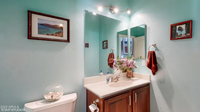a bathroom with a sink vanity and a mirror