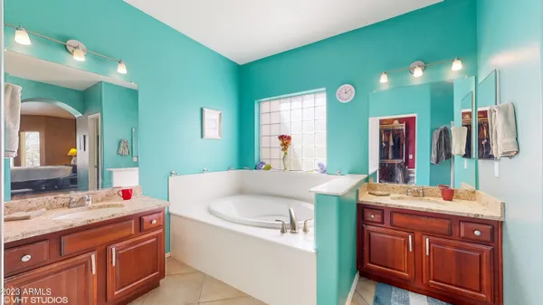 a bathroom with a sink vanity and mirror
