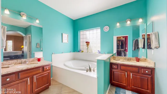 a bathroom with a sink vanity and mirror