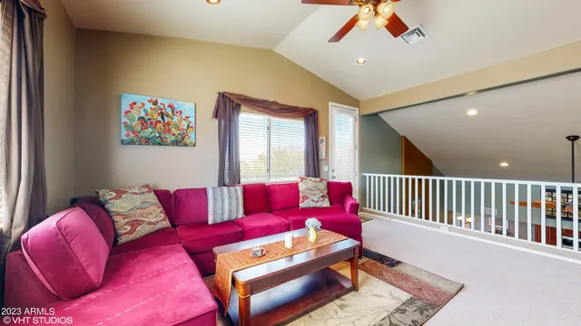 a living room with furniture and a rug