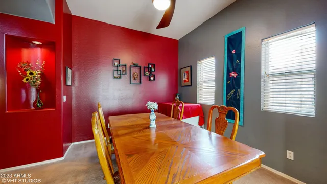 a view of a dining room with furniture and chandelier
