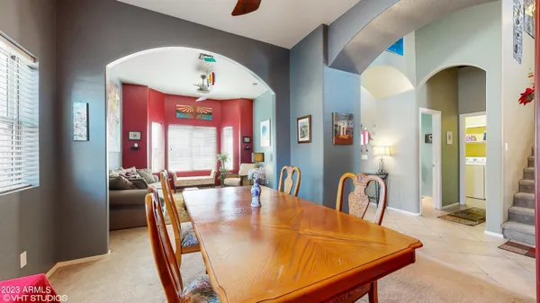 a dining room with furniture and window