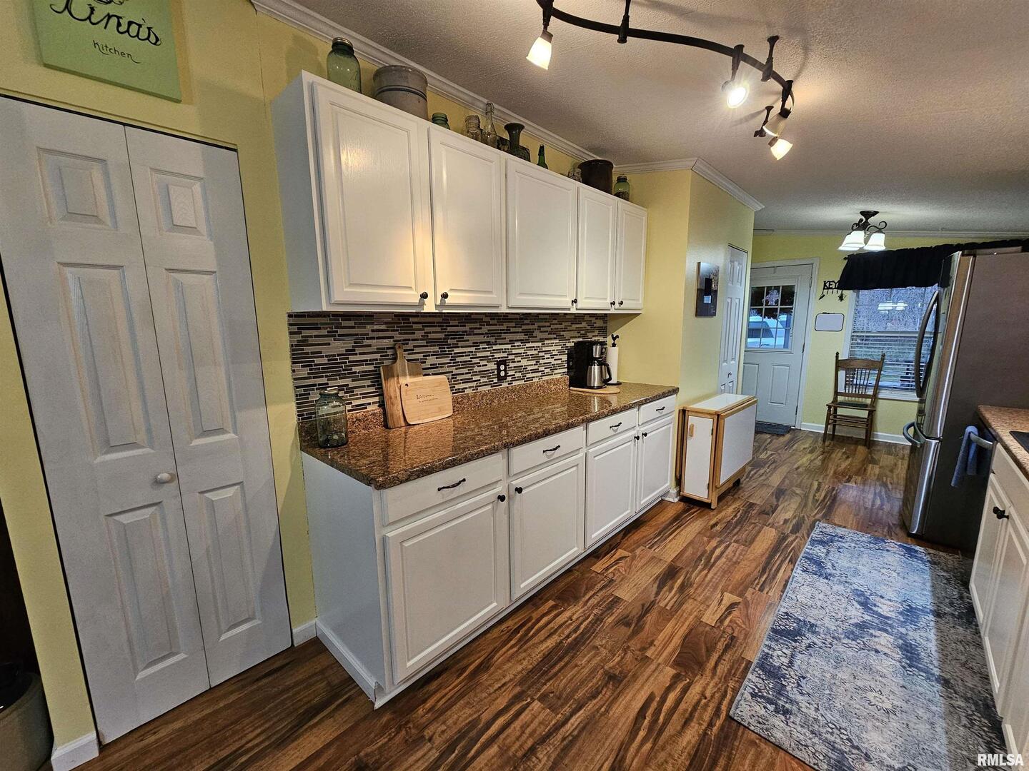 18266 East Liberty Road Opdyke, IL 62872 - Photo 21 of 34 a kitchen with sink cabinets and wooden floor