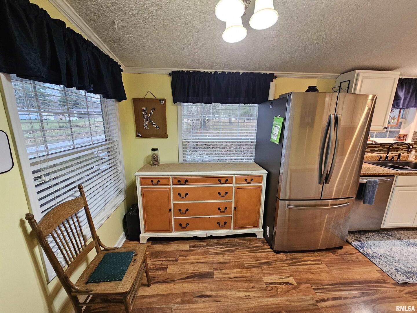 18266 East Liberty Road Opdyke, IL 62872 - Photo 23 of 34 a kitchen with stainless steel appliances granite countertop a refrigerator and a stove top oven