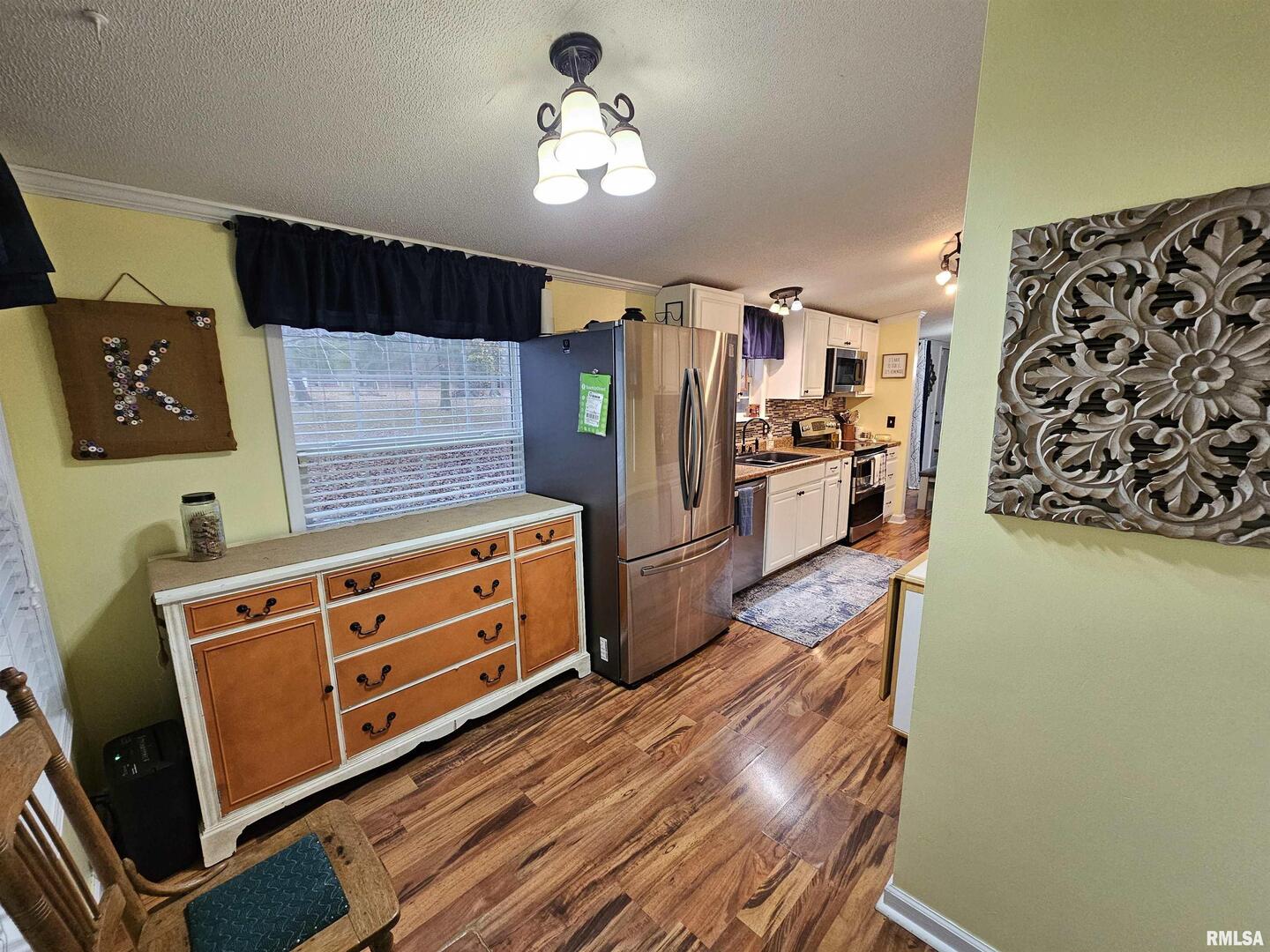 18266 East Liberty Road Opdyke, IL 62872 - Photo 25 of 34 a kitchen with stainless steel appliances a stove a refrigerator and cabinets
