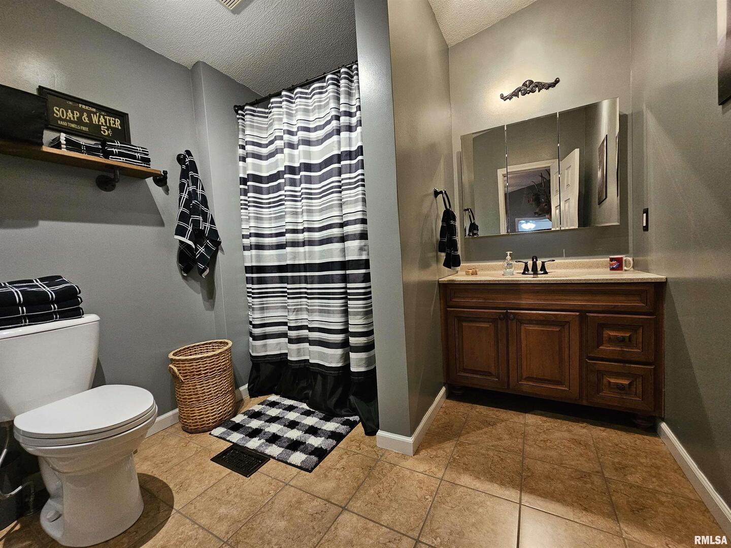 18266 East Liberty Road Opdyke, IL 62872 - Photo 28 of 34 a bathroom with a toilet sink and mirror