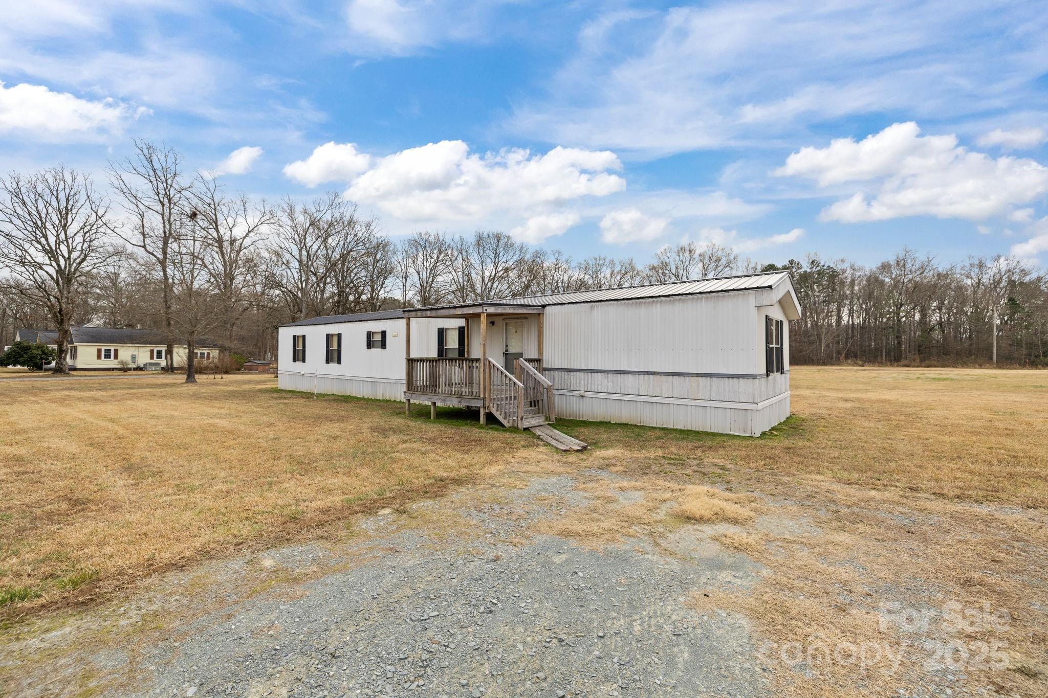 2909 New Town Road Monroe, NC 28110 - Photo 23 of 31 a view of a house with a yard