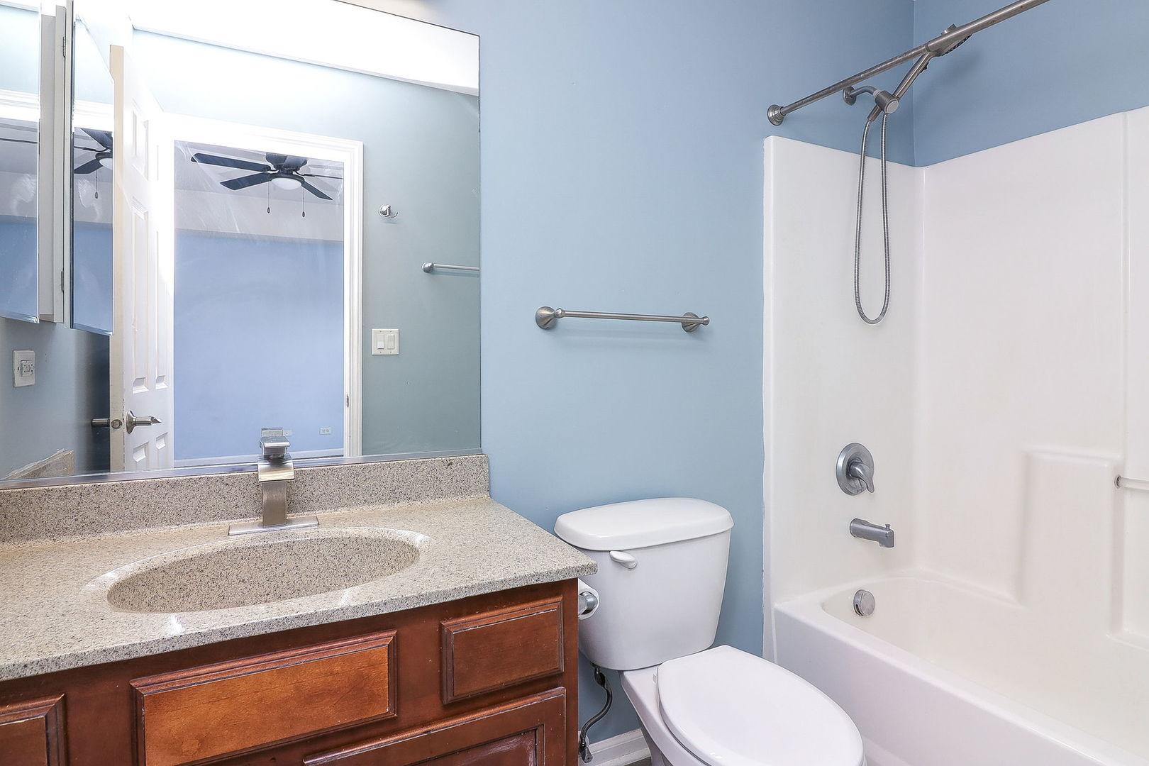 317 Timber Ridge Court, Unit 131 Joliet, IL 60431 - Photo 12 of 23 a bathroom with a granite countertop sink toilet and shower