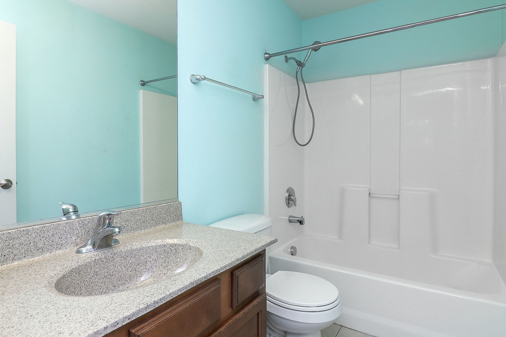 317 Timber Ridge Court, Unit 131 Joliet, IL 60431 - Photo 14 of 23 a bathroom with a granite countertop sink a toilet and shower