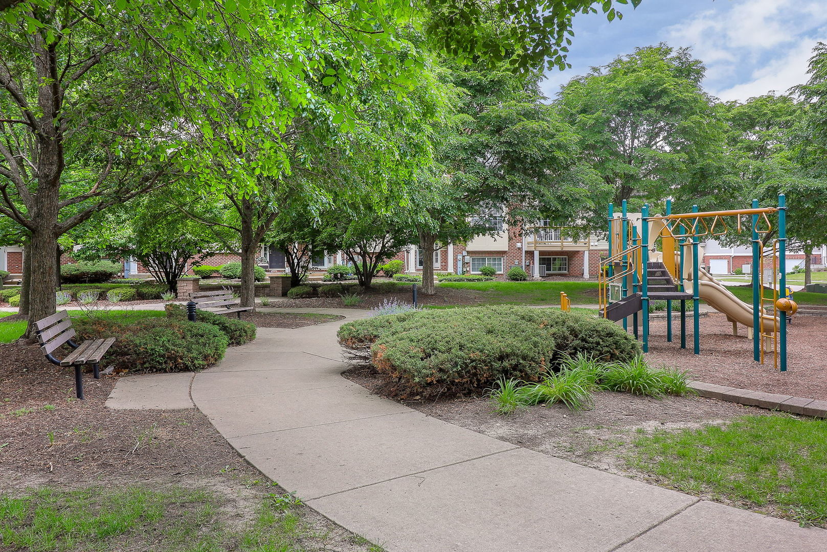 317 Timber Ridge Court, Unit 131 Joliet, IL 60431 - Photo 21 of 23 a view of a garden with plants and trees