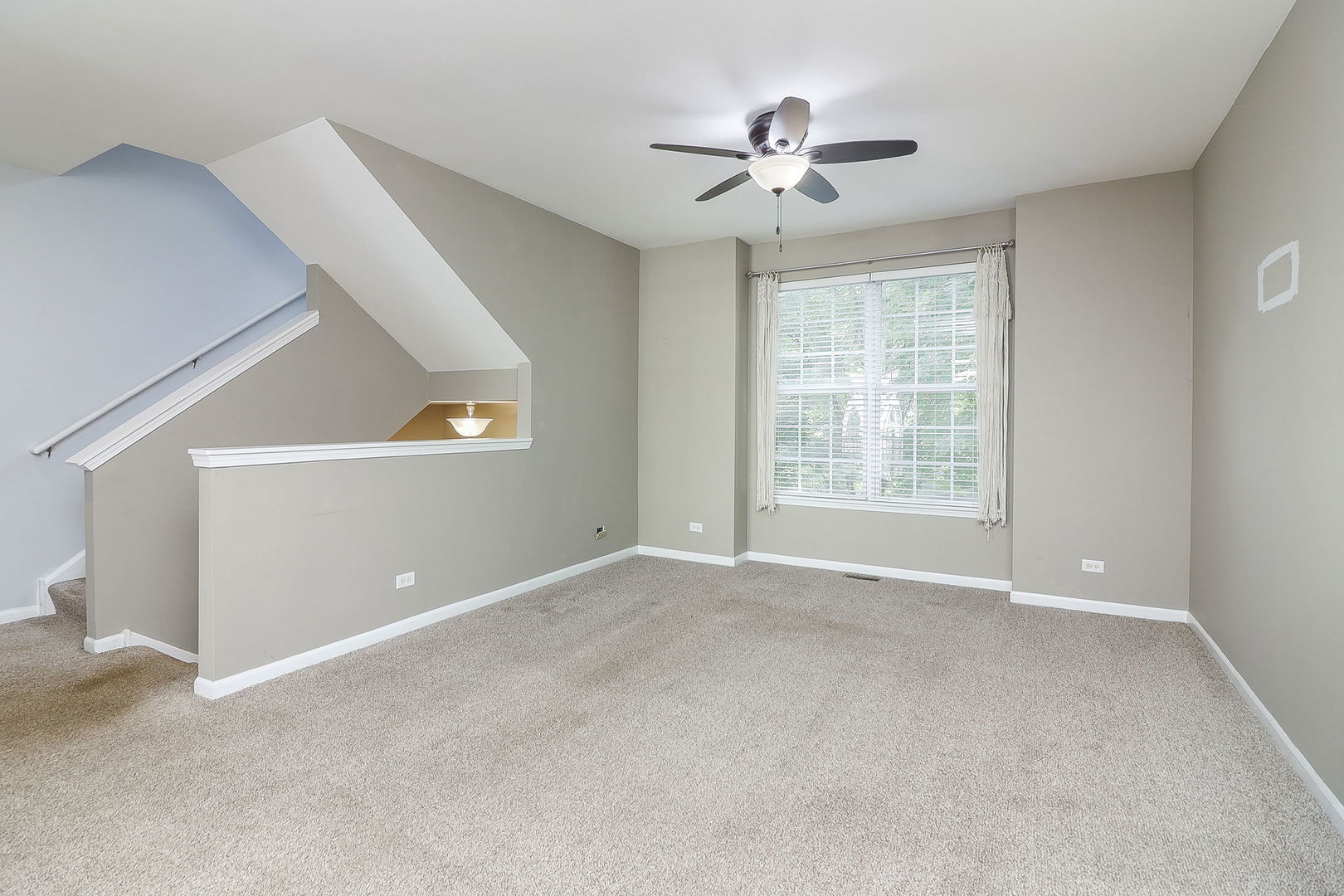 317 Timber Ridge Court, Unit 131 Joliet, IL 60431 - Photo 3 of 23 a view of an empty room with a window