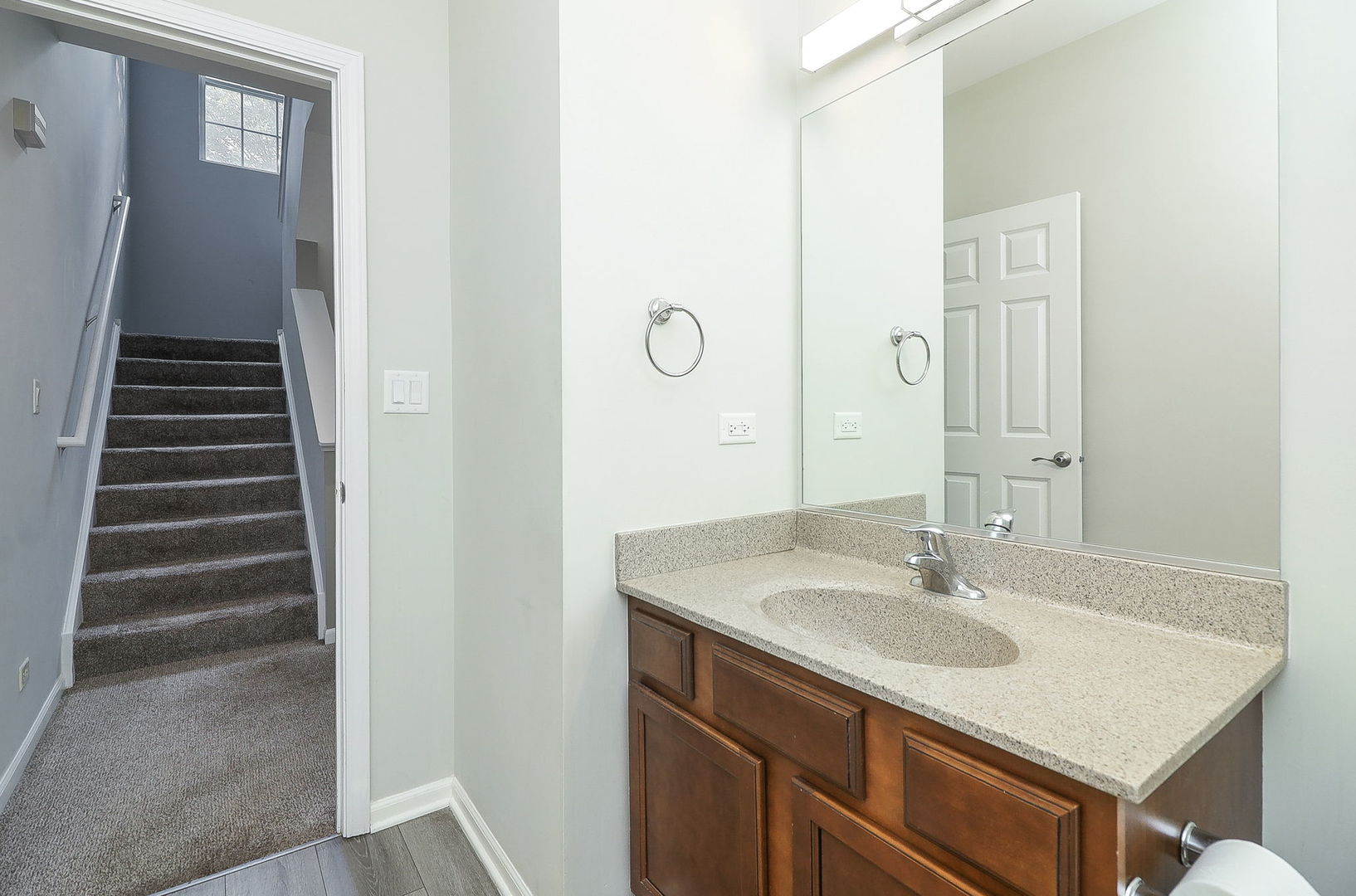 317 Timber Ridge Court, Unit 131 Joliet, IL 60431 - Photo 10 of 23 a bathroom with a sink and a mirror
